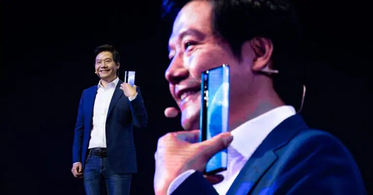 - IMD Business School Man holding a phone - IMD Business School