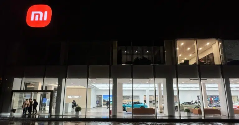 - IMD Business School Building front with a Xiaomi logo - IMD Business School