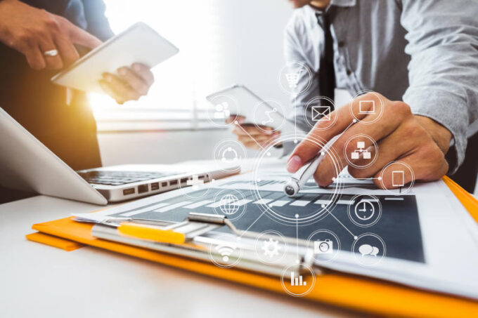 Business team present professional investor working new start up project Digital tablet laptop computer Finance managers meeting with digital marketing media in virtual icon in morning light