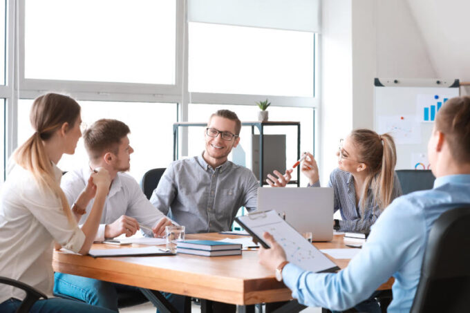 Group of young people at business meeting in office