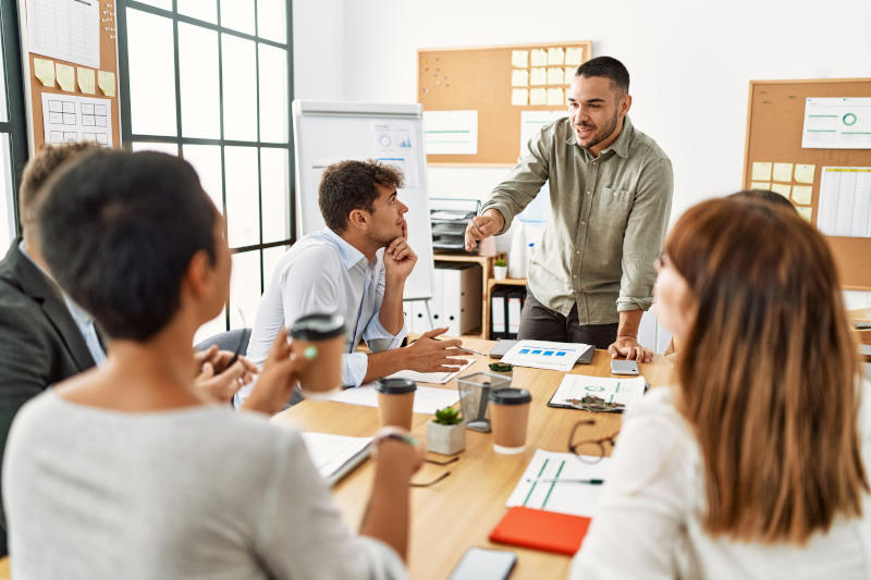 Group of business workers listening boss conference during meeting at the office