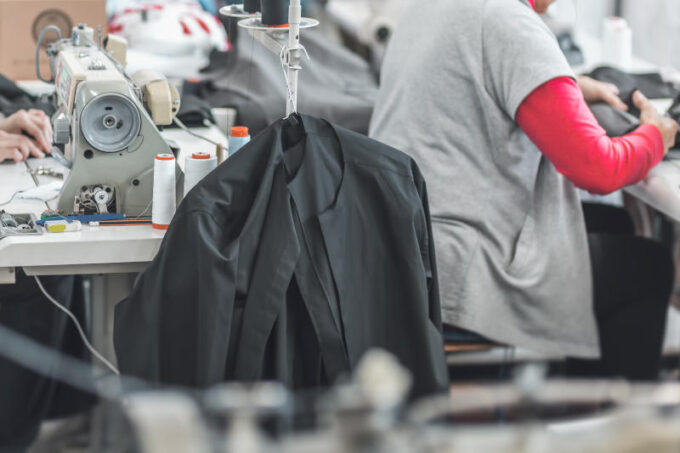 clothing industry workers working on sewing machines