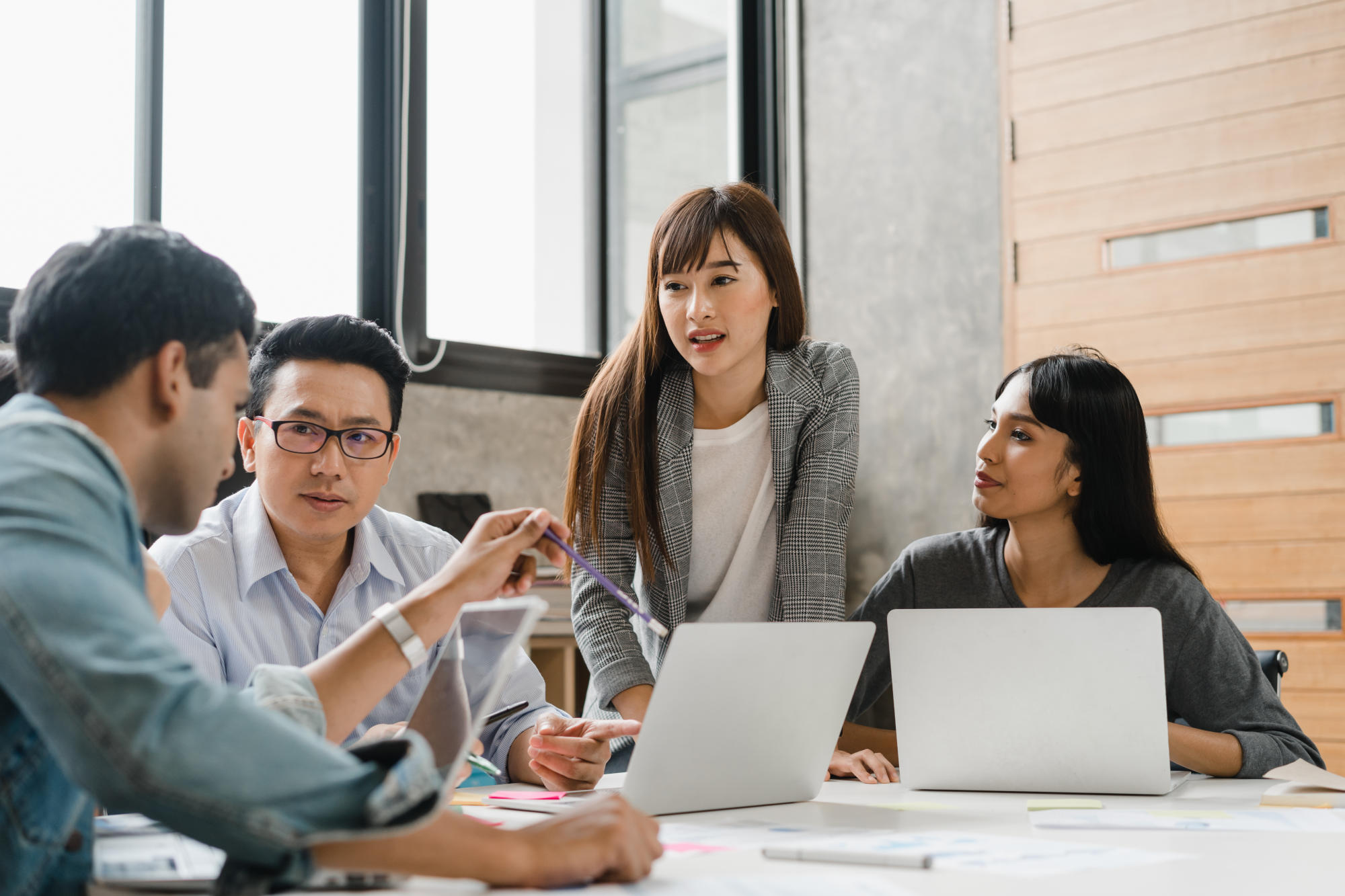 Multiracial group of young creative people in casual wear meetin