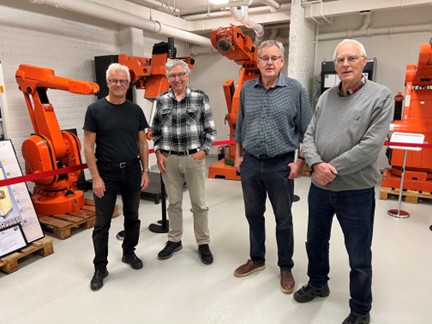 Jan Jonsson left and retired colleagues Hans Skoog Ove Leichsenring and Thord Porsander at the robotics display at the ASEA Historical Collection in Västerås - IMD Business School
