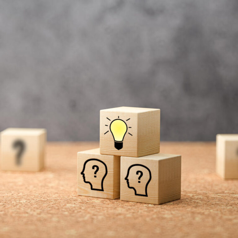 cubes showing a brainstorming session on concrete background