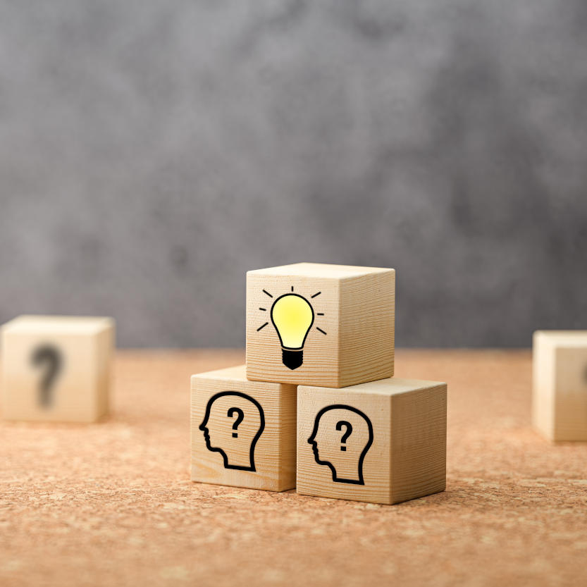 cubes showing a brainstorming session on concrete background