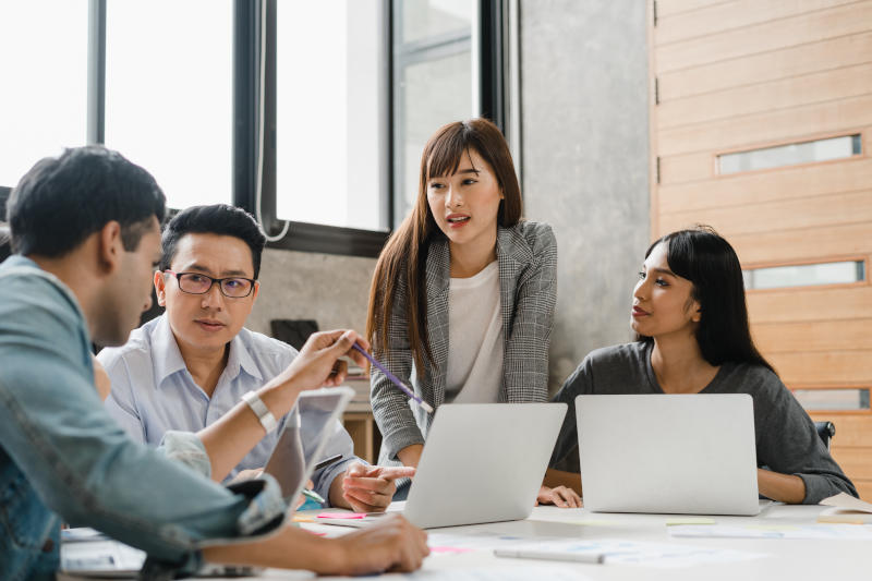 Multiracial group of young creative people in casual wear meetin