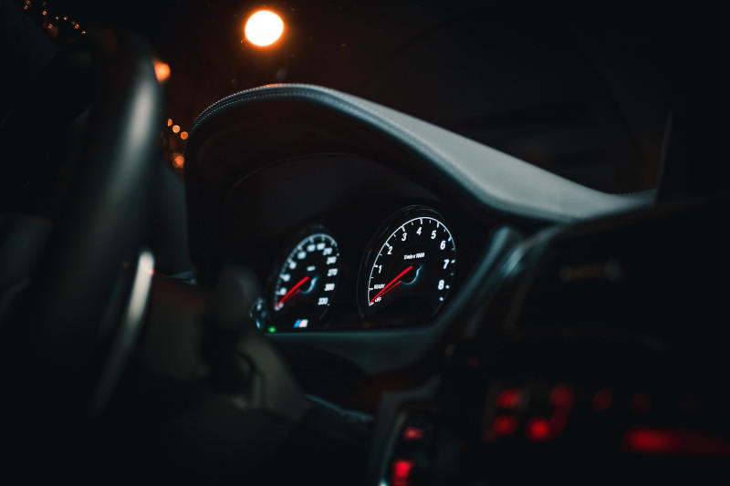 dashboard of a sports car at night