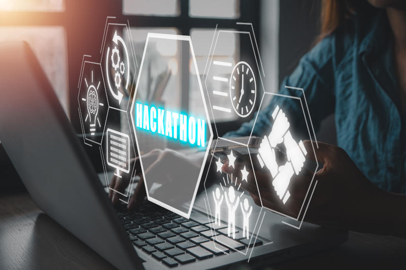 Hackathon concept Business woman using laptop computer on office desk with hackathon icon on virtual screen