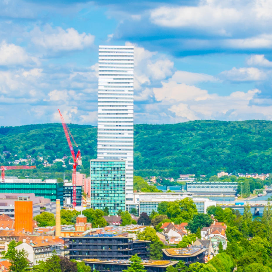 Riverside of Rhine dominated by the Roche tower in Switzerland - square
