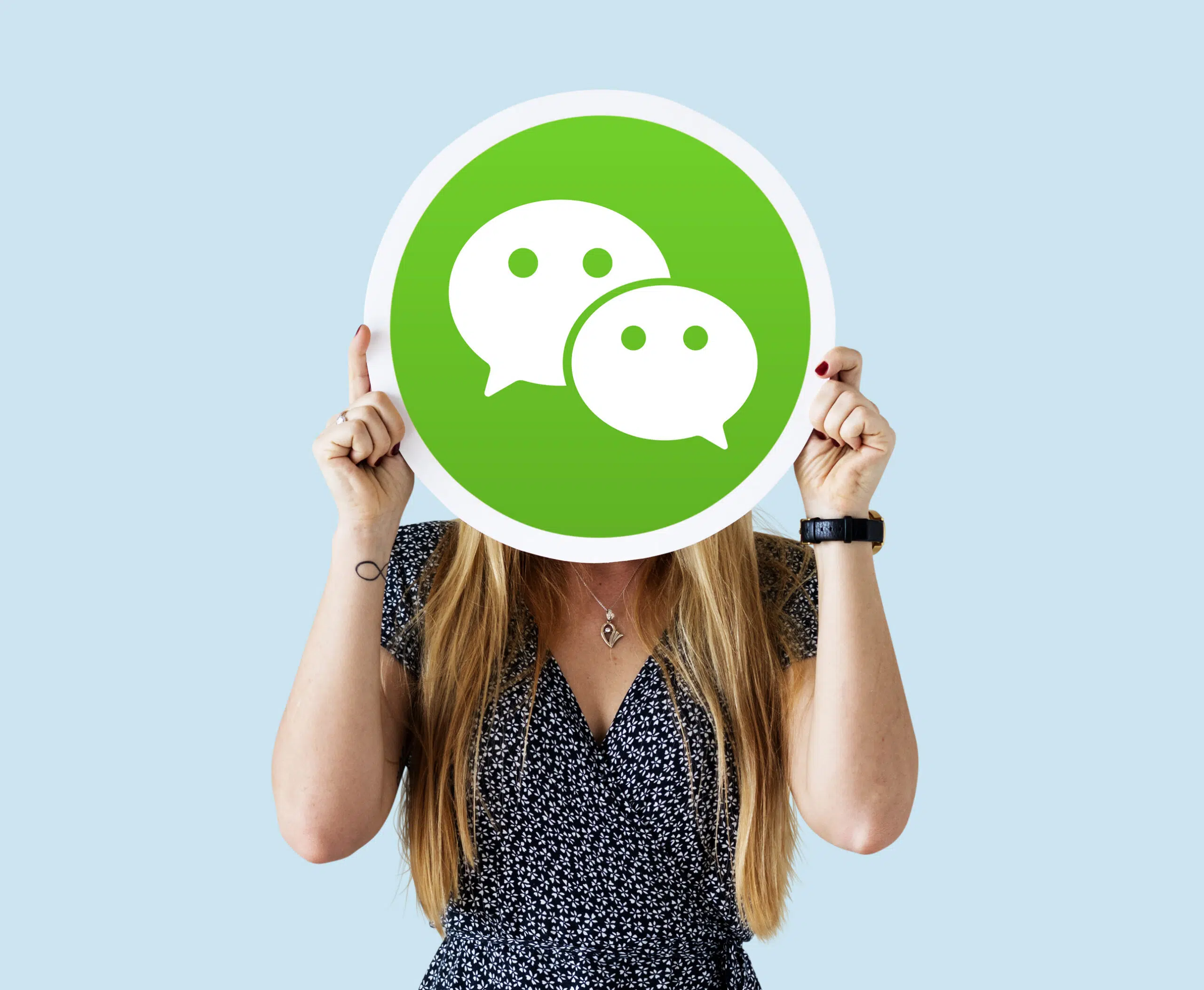 Woman holding a social network icon - IMD Business School