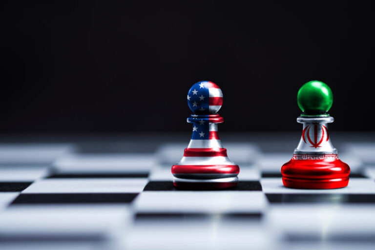 USA flag and Iran flag print screen on chess with black backgroundIt is symbol of United state of America and Iran have conflict in nuclear weapons and Strait of Hormuz