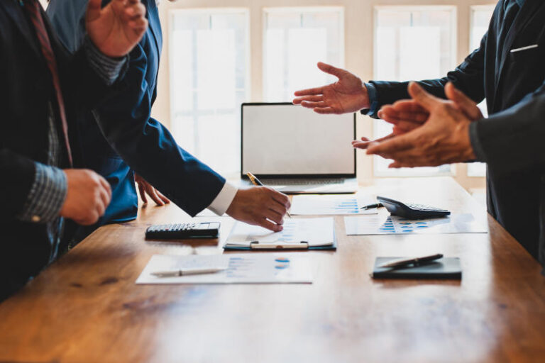 Meeting people in an organization to discuss and plan business s
