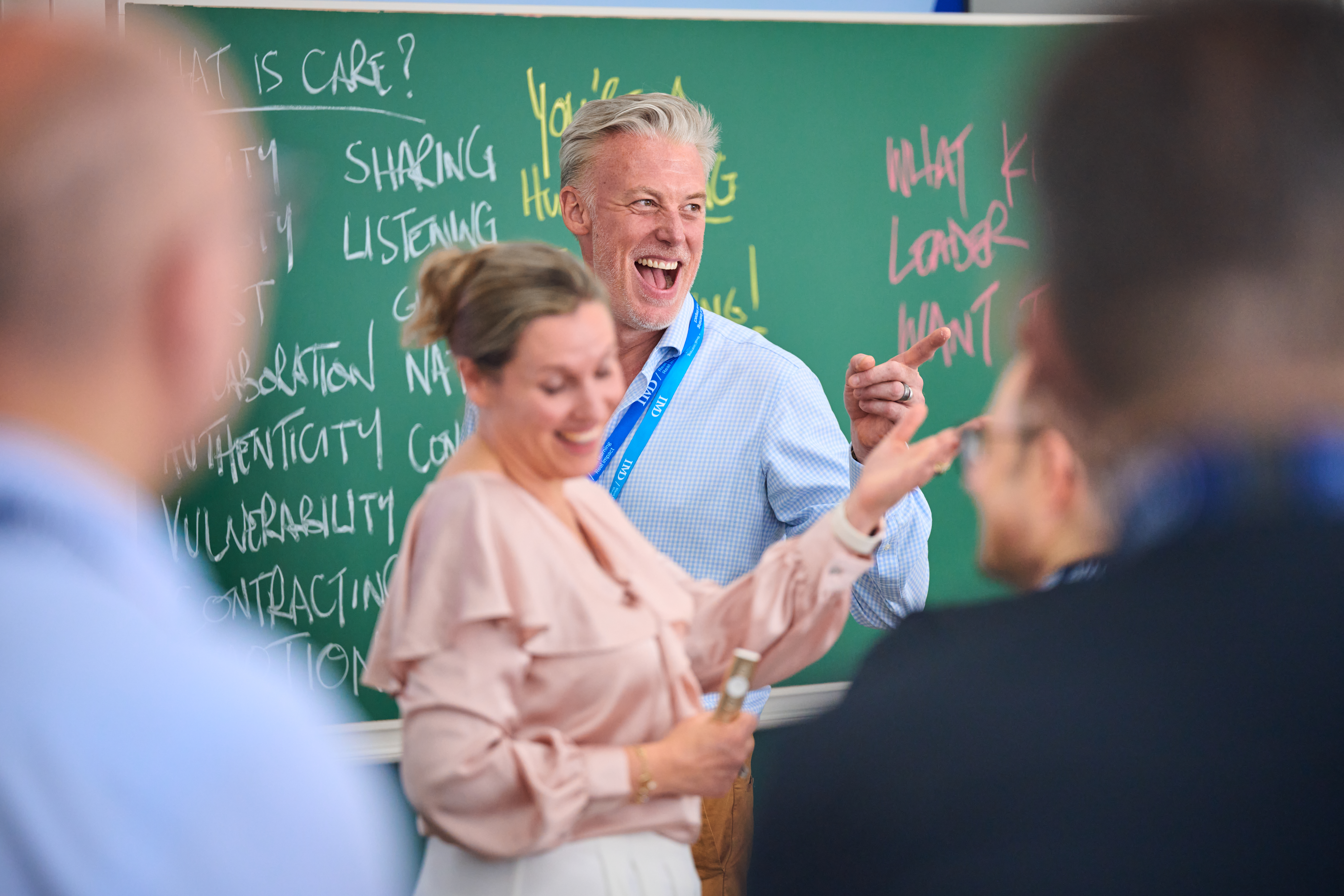 Participants engaged in a classroom discussion during IMD's Orchestrating Winning Performance (OWP) program. - IMD Business School