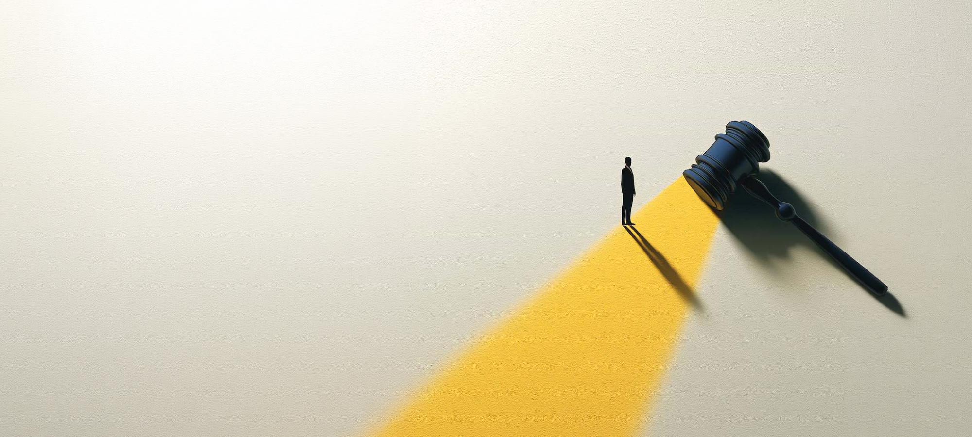 Small silhouette of a person on a yellow path facing a large gavel, symbolizing pursuit of justice.