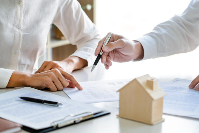 employee meeting broker estate agent for contact to apartment and signing document agreement