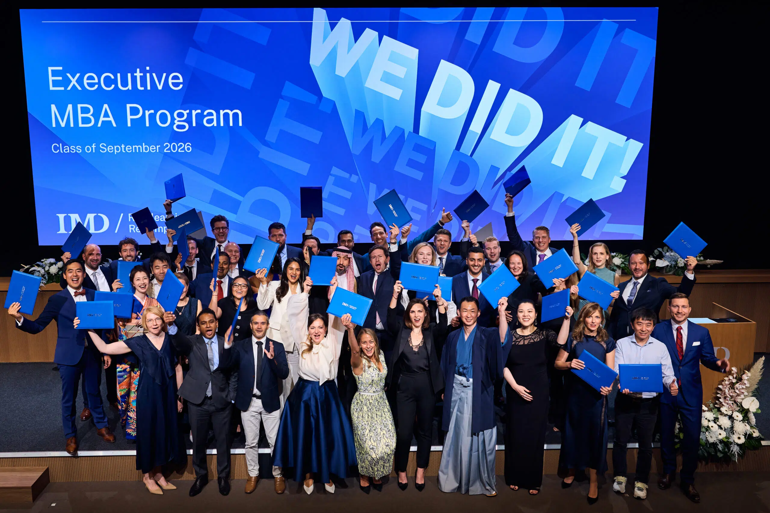 EMBA Class of September 2026 hold their degree certificates at a ceremony in Lausanne - IMD Business School