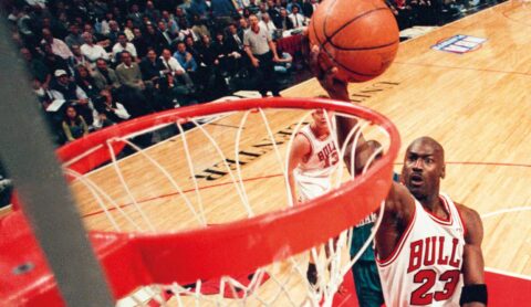 Michael Jordan playing for the Chicago Bulls, credited Sporting News via Getty Images.