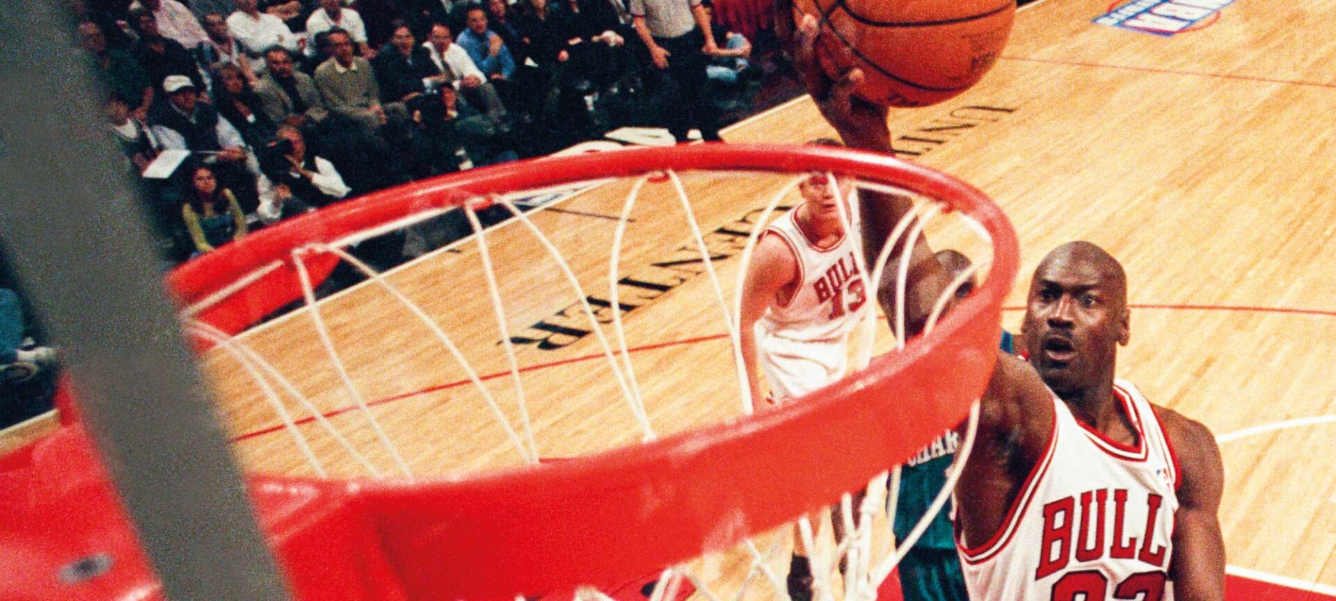 Michael Jordan playing for the Chicago Bulls, credited Sporting News via Getty Images.