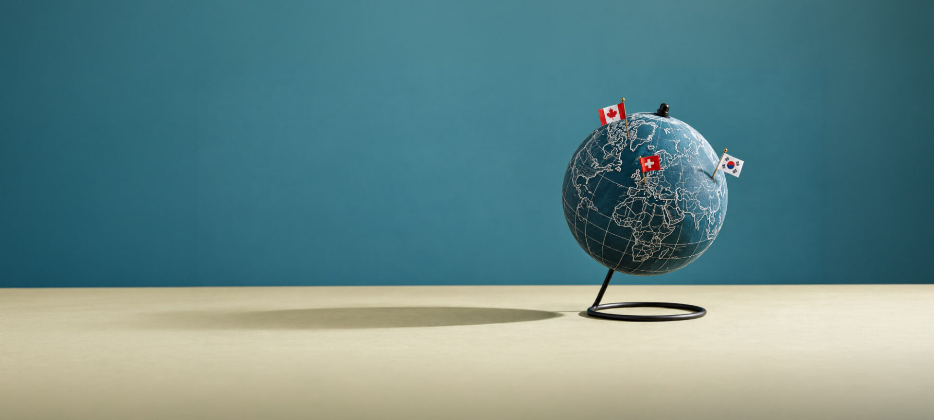 Globe on a desk showcasing 3 countries