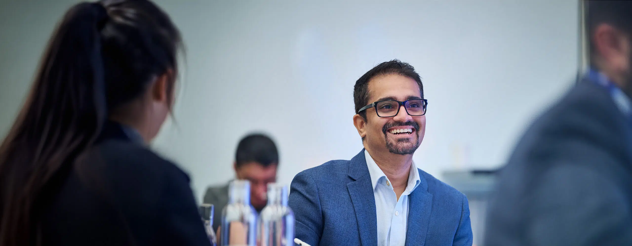 Advanced Management Program participant in discussion with peers at IMD - IMD Business School