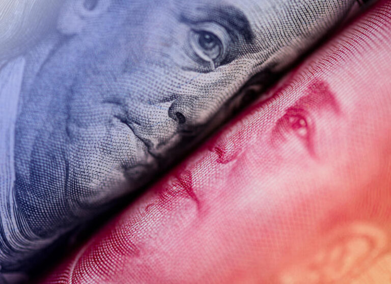 Face to face of Benjamin Franklin and Mao Tse tung from US dollar and China Yuan banknote. It is symbol of economic tariffs trade war.
